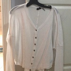 White Out from under Urban Outfitters sweater top.